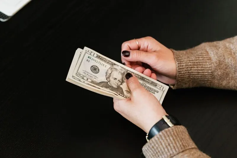 Cash being counted by hand